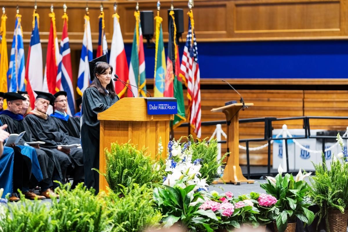 woman at graduation speaking at podium