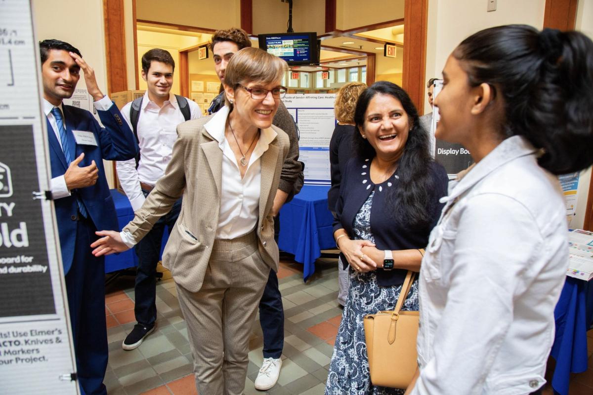 Dean Judith Kelly talking with students