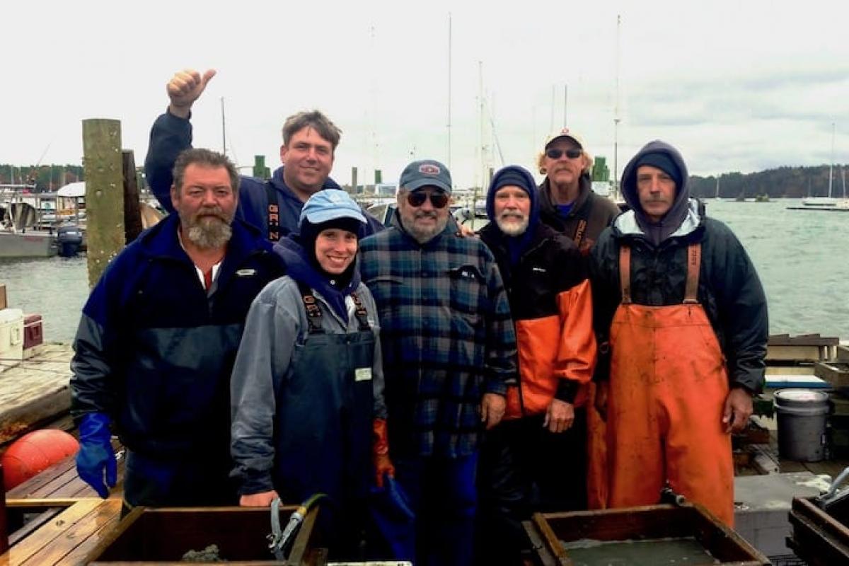 Many fishermen posing together
