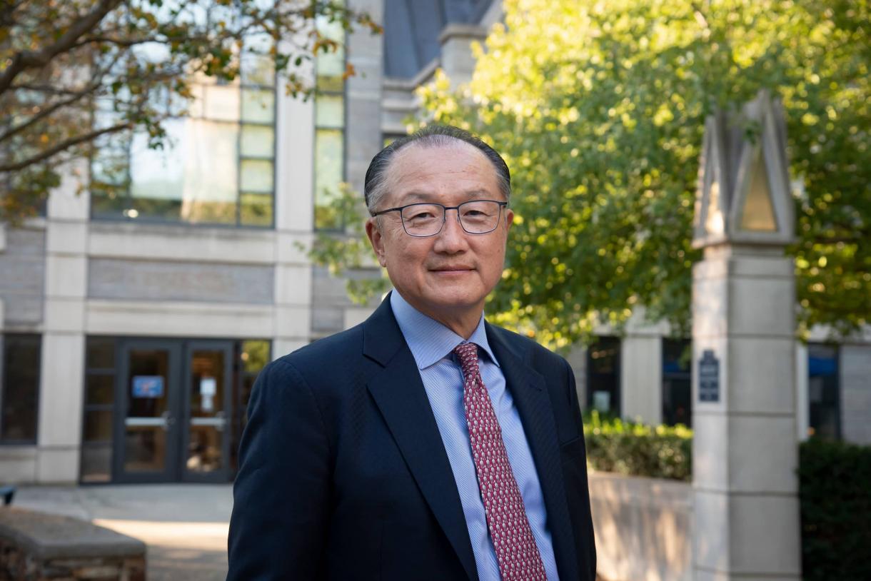 Dr. Jim Yong Kim looking into the camera outside of the Sanford School