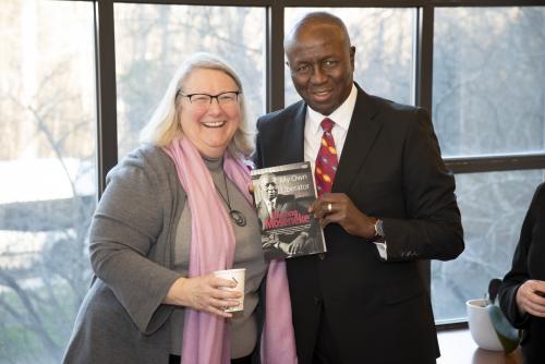 Dikgang Moseneke posing with Sanford faculty member Catherine Admay