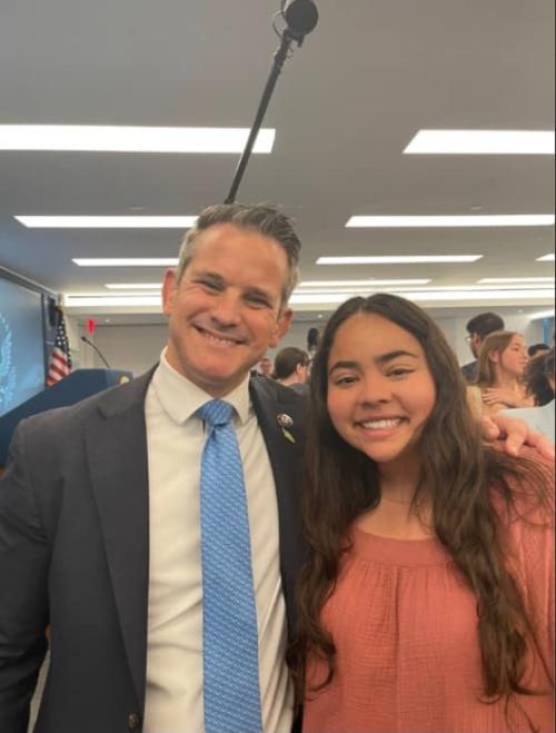 Student smiling with Congressman