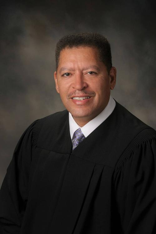 African American man wearing Judge's robes