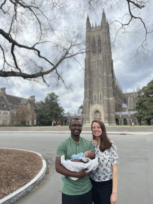 Man, woman and child, Duke chapel in background